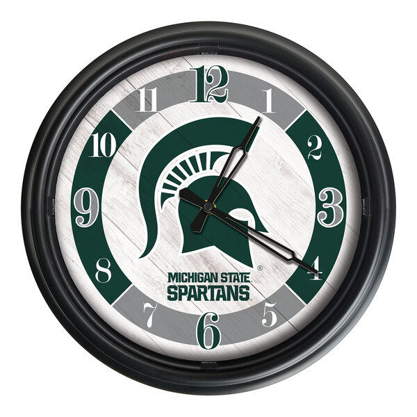 A Holland Bar Stool Michigan State Spartans wall clock with a green and white logo.