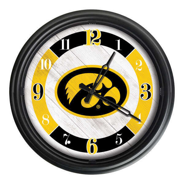 A white Holland Bar Stool wall clock with the University of Iowa Hawkeyes logo in black and yellow.