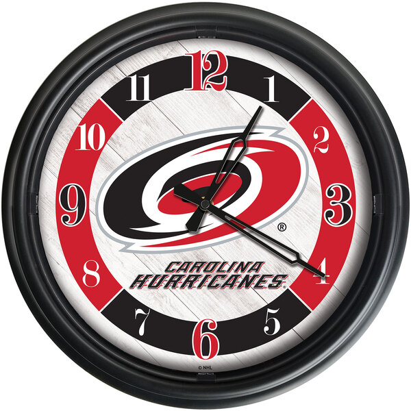 A white Holland Bar Stool wall clock with the Carolina Hurricanes logo on it.