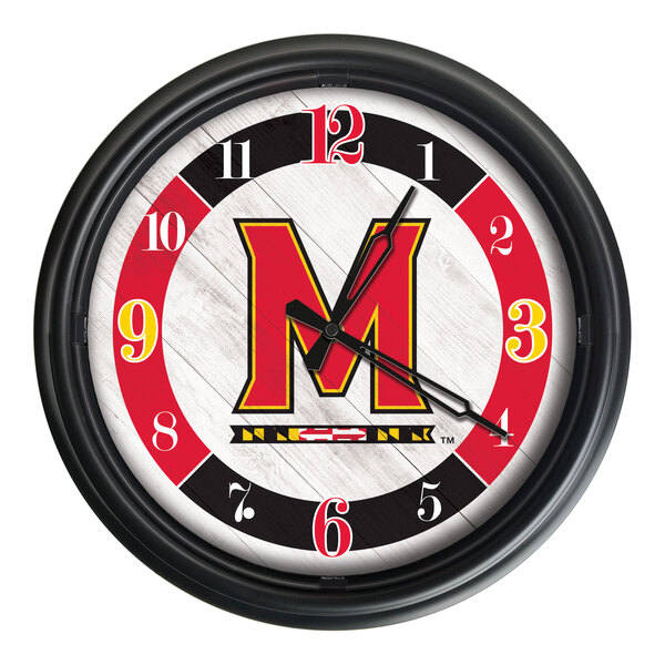 A round wall clock featuring the University of Maryland logo with a black frame and red, black, and white accents.