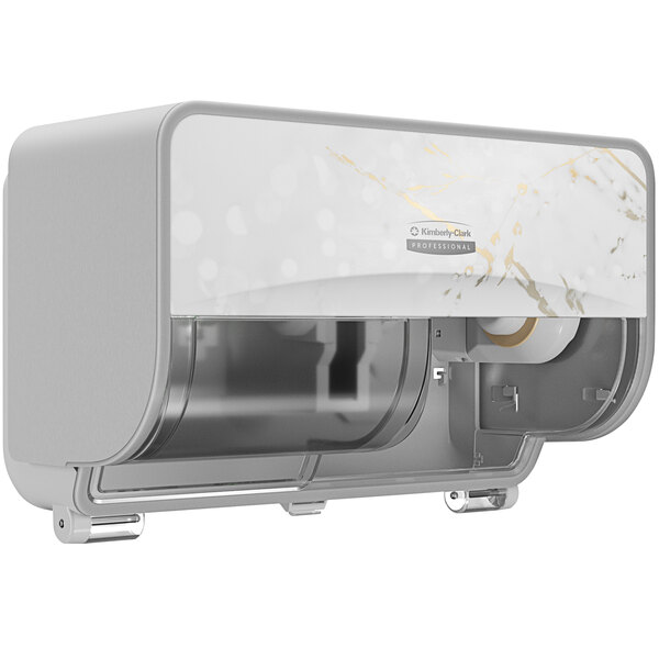 A white and gold Kimberly-Clark Professional ICON toilet paper dispenser.