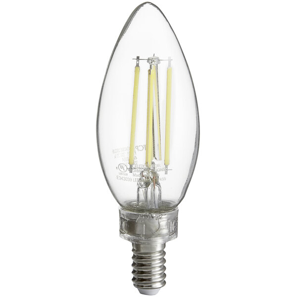 A close-up of a TCP clear filament LED light bulb with a clear base.