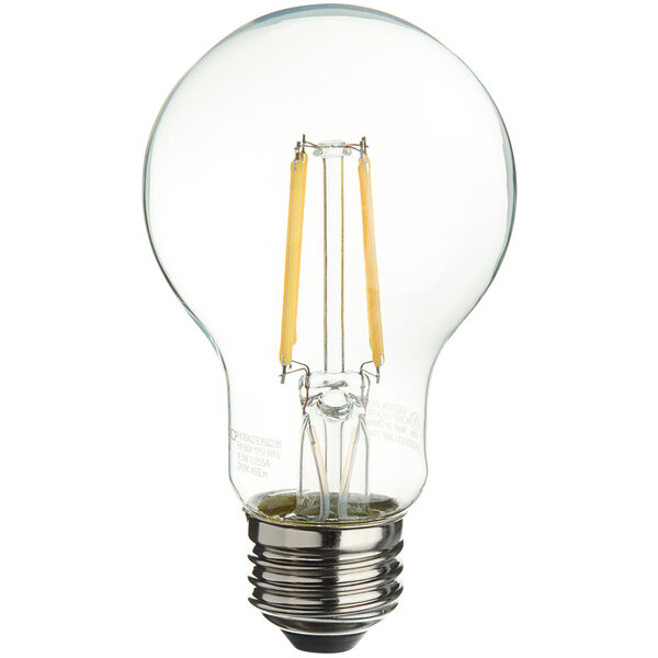 A TCP clear filament LED light bulb with a yellow filament.