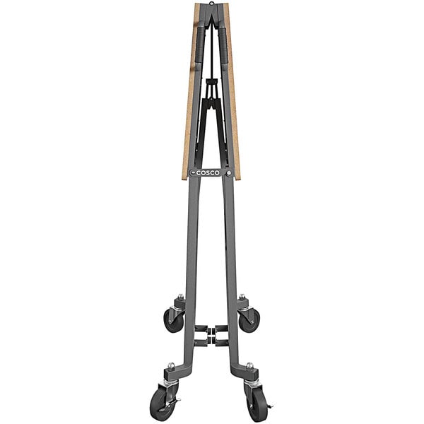 A Cosco portable folding work desk with a metal stand and wheels.