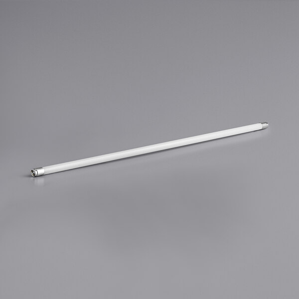 A TCP white LED tube on a gray surface.