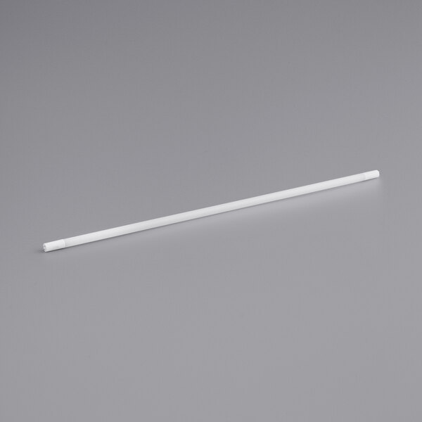 A TCP LiberaT8 LED tube with white ends on a gray surface.