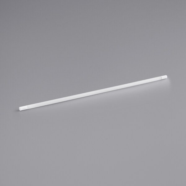 A frosted white TCP LiberaT8 LED tube on a gray surface.