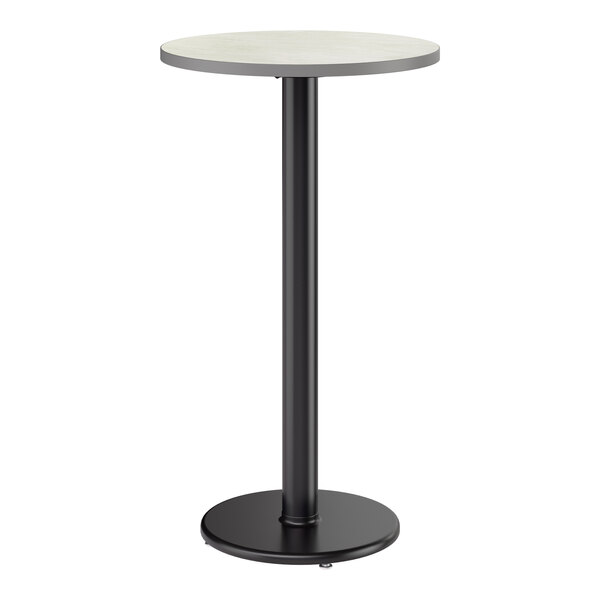 A round bar height table with a reversible gray and white laminated top and a black cast iron base.