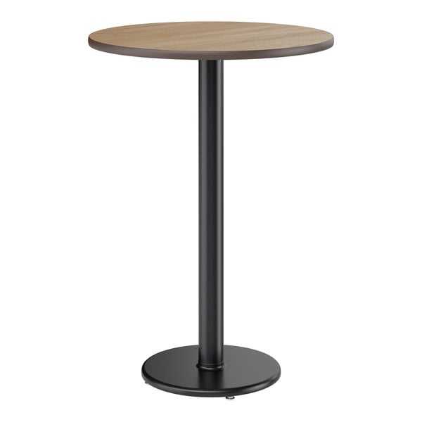 A round bar height table with a reversible white birch or ash laminated top and a black cast iron base.