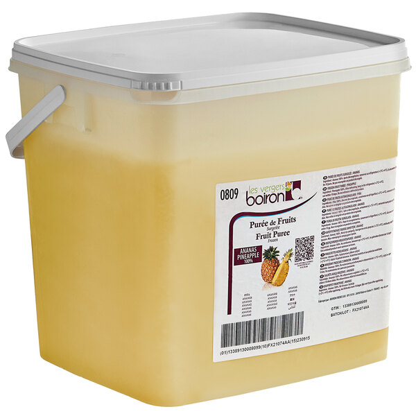 A plastic container of Les Vergers Boiron Pineapple 100% Fruit Puree with a white lid.