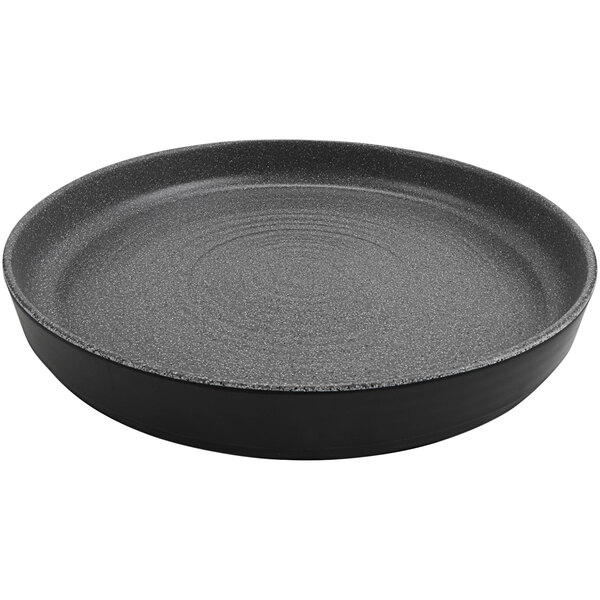 A round black melamine platter with a raised rim.