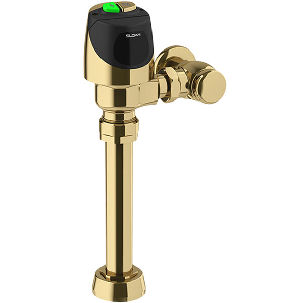 A close-up of a Sloan polished brass dual flush exposed sensor water closet flushometer with a green button.