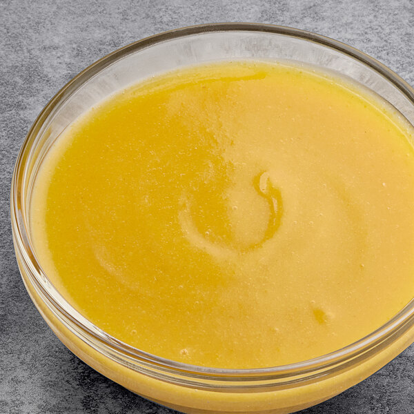 A bowl of Les Vergers Boiron Mirabelle Plum fruit puree.