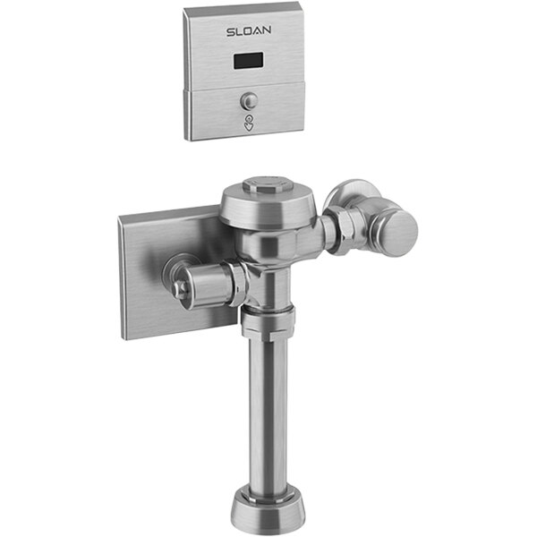 A silver metal Sloan Royal water closet flusher with a button.