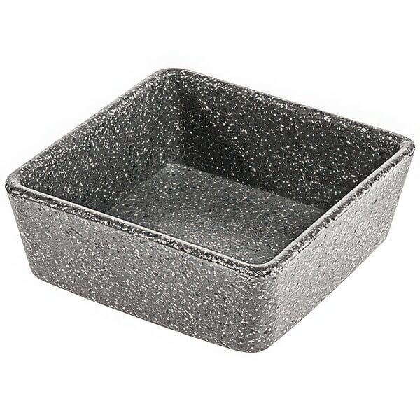 A cheforward square stone grey melamine ramekin with a gray speckled surface.