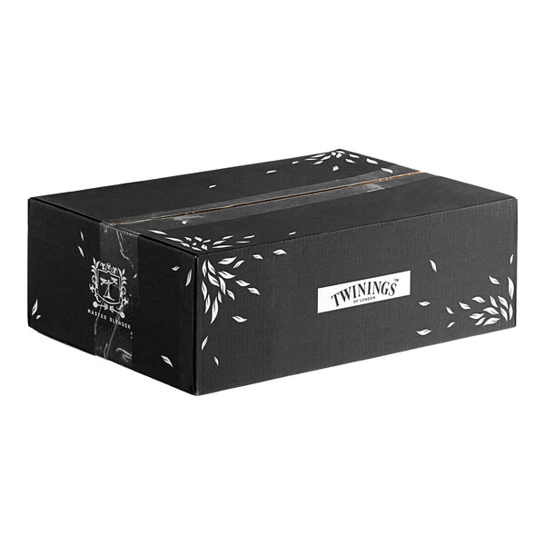 A black Twinings tea sachet box with white text and leaves.