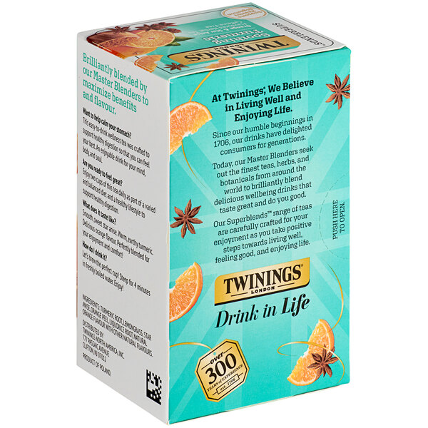 A box of Twinings Soothe Turmeric, Orange & Star Anise Herbal Tea with oranges and anise on the front.