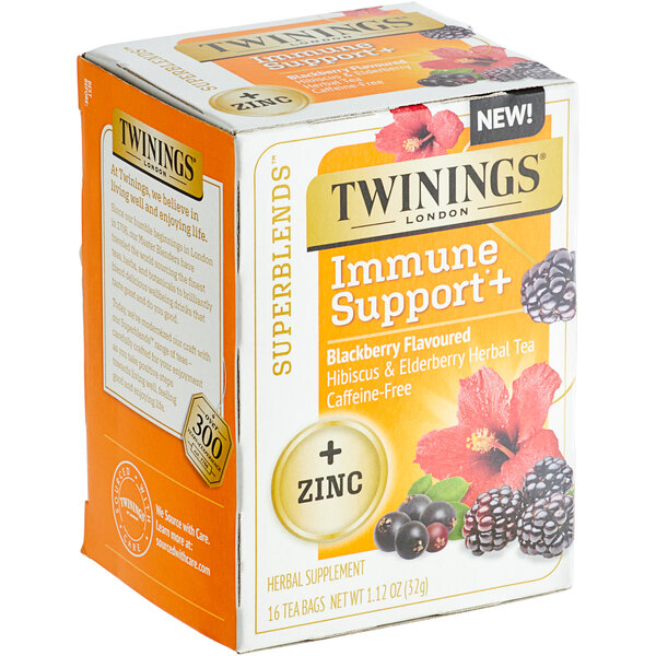 A box of Twinings Immune Support Blackberry, Hibiscus, & Elderberry herbal tea bags on a table.