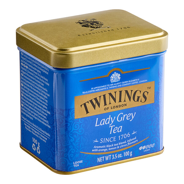 A blue and gold Twinings Lady Grey tea tin.