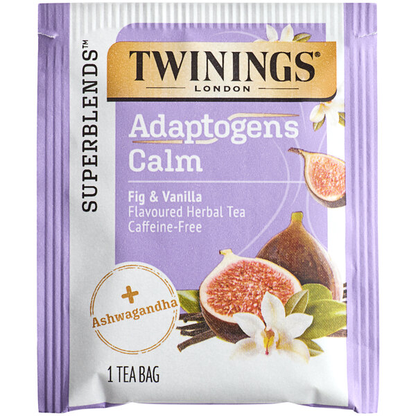 A purple and white package of Twinings Calm Adaptogens Fig & Vanilla Tea Bags with a close-up of a fig fruit.