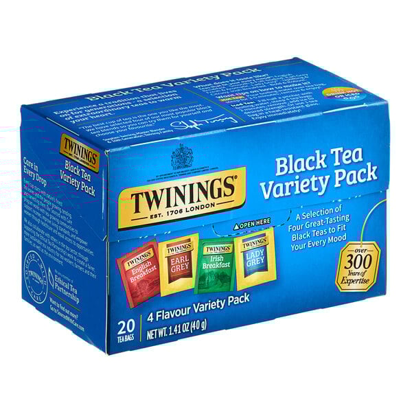 A blue Twinings box with different colored packets of black tea.