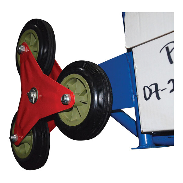 A close-up of a Vestil steel stair hand truck wheel with a red and green wheel on it.