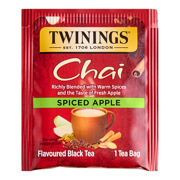 A red box of Twinings Spiced Apple Chai Tea Bags with a label.