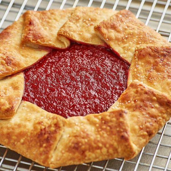 A close up of a pastry with red Raspberry Bakery Jam on top.