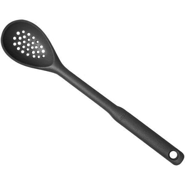 A gray OXO Good Grips silicone spoon with holes in it.