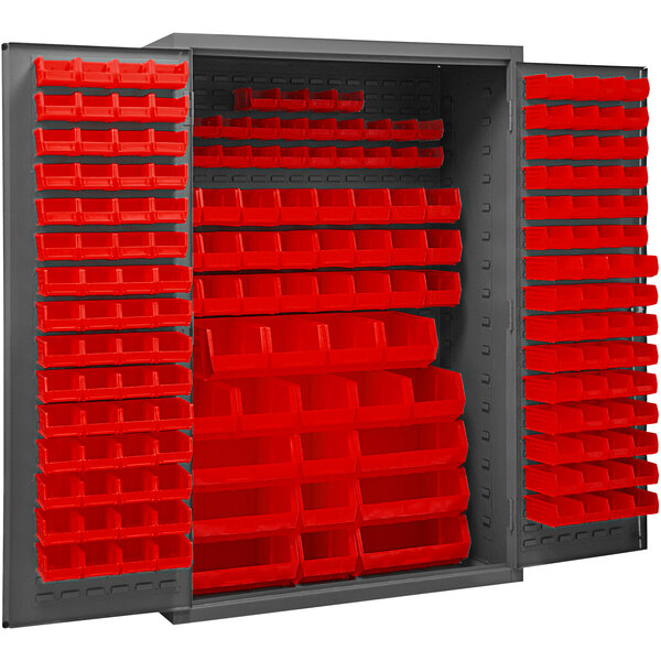 A large metal Durham storage cabinet with red bins inside.