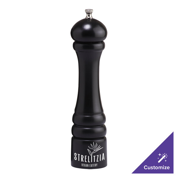 A black pepper mill with white text that says "Imperial" on the table.