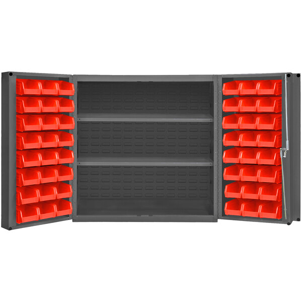 A grey metal Durham storage cabinet with red bins on shelves.