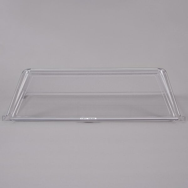 An APW Wyott single door sneeze guard on a white surface.