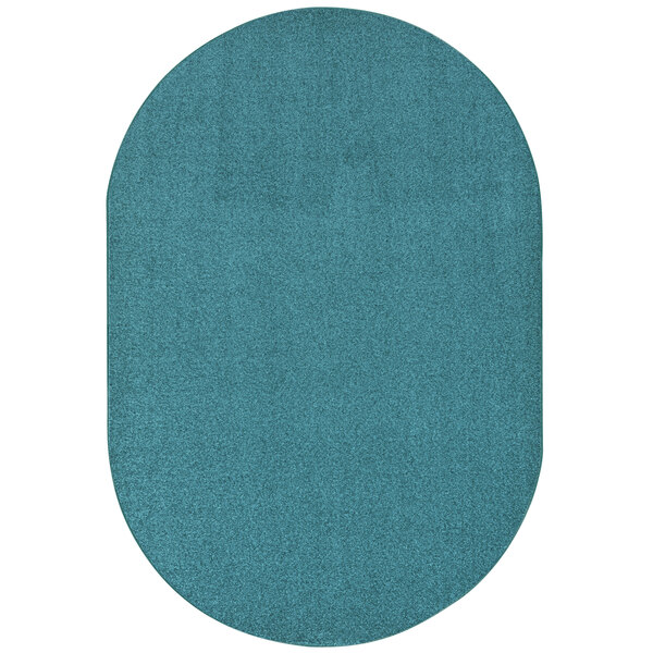 A mint oval rug with a white background.