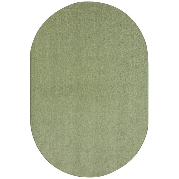 A close-up of a green oval rug with white accents.