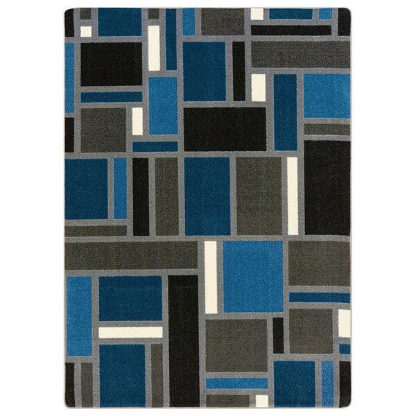 A blue and black rectangular area rug with squares and lines in a white room.