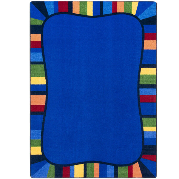 A blue rug with a multicolored border.