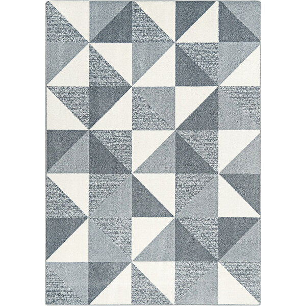 A Joy Carpets Claremont Kids rug with grey and white triangles in a pattern.