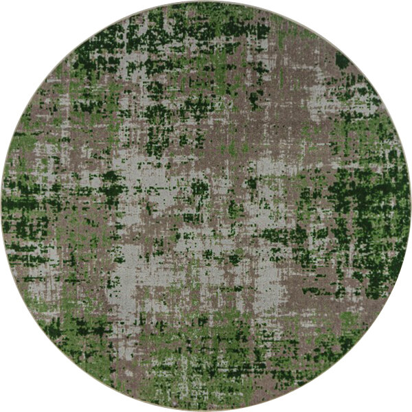 A close-up of a round green and white circular rug with green and brown spots.