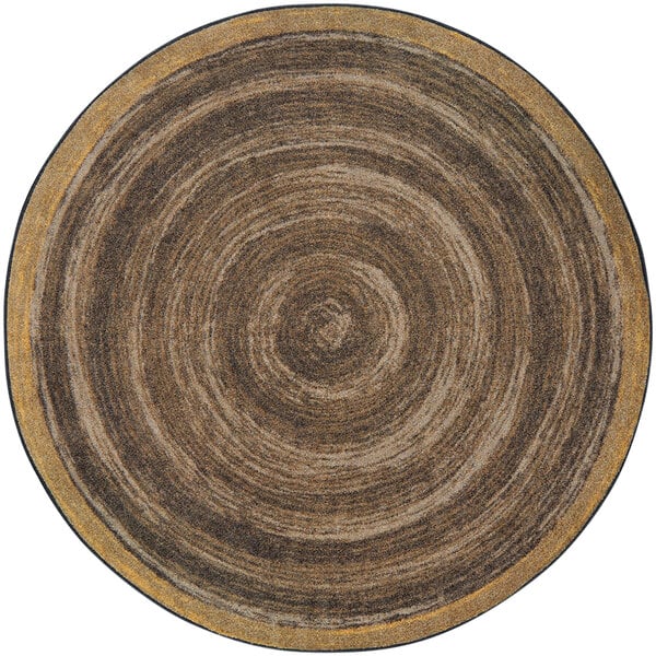 A Joy Carpets Feeling Natural walnut round area rug with a circular pattern in brown and black.