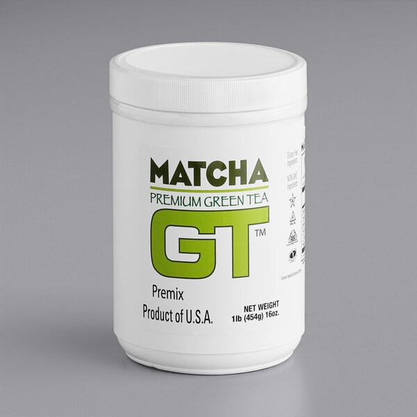 A white container of Add A Scoop Premium Matcha Green Tea Powder with green text.