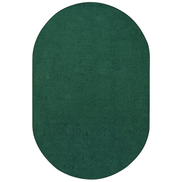 An oval forest green rug with a white border.