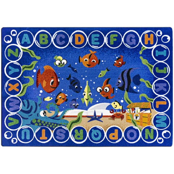 A white rectangular area rug with a blue border and underwater scenes, including fish and letters.