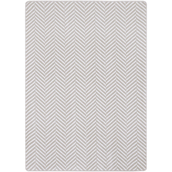 A white rectangular Joy Carpets area rug with a chevron pattern in gray and black.