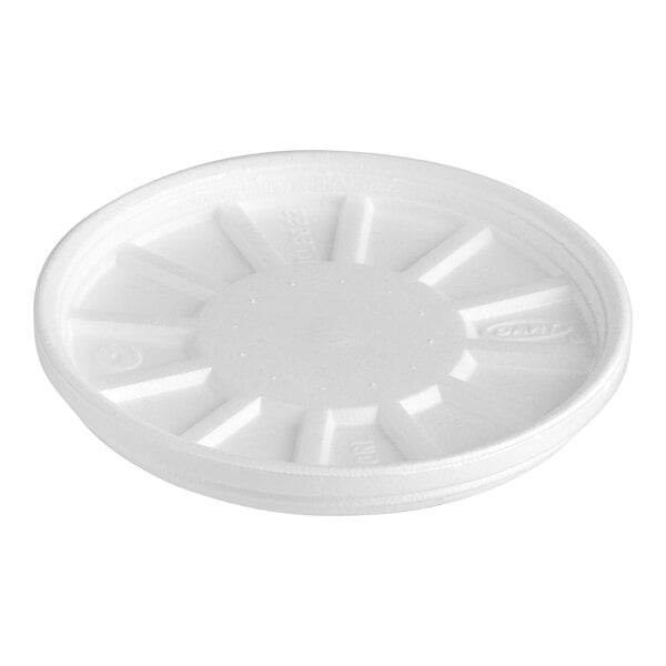 A white styrofoam lid with a circular design.