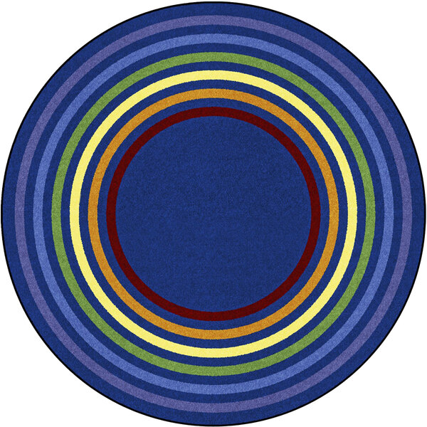 A multicolored circular rug with rings of different colors.