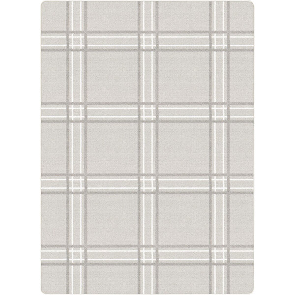 A white area rug with a grey checkered plaid pattern.