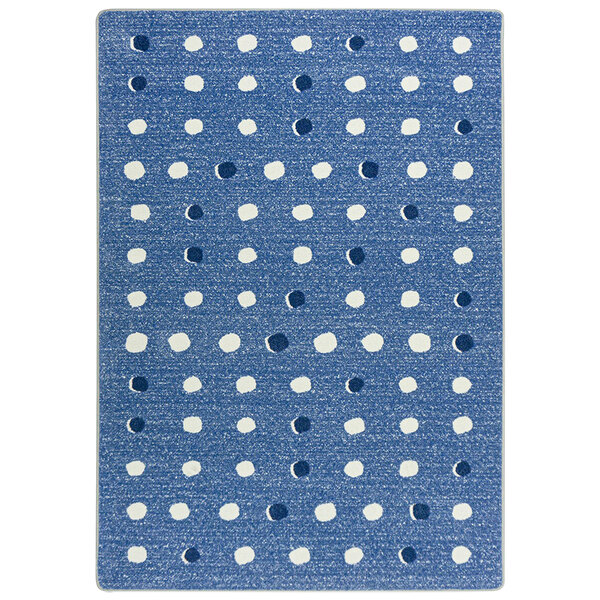 A blue and white rug with white dots.