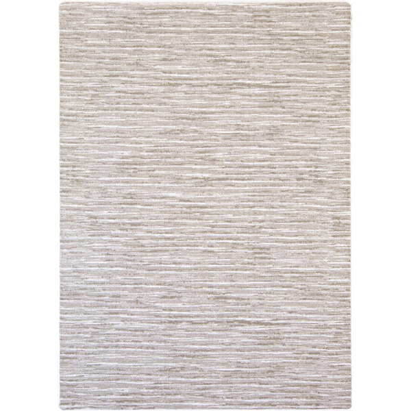 A white area rug with a light gray pattern on a white surface.