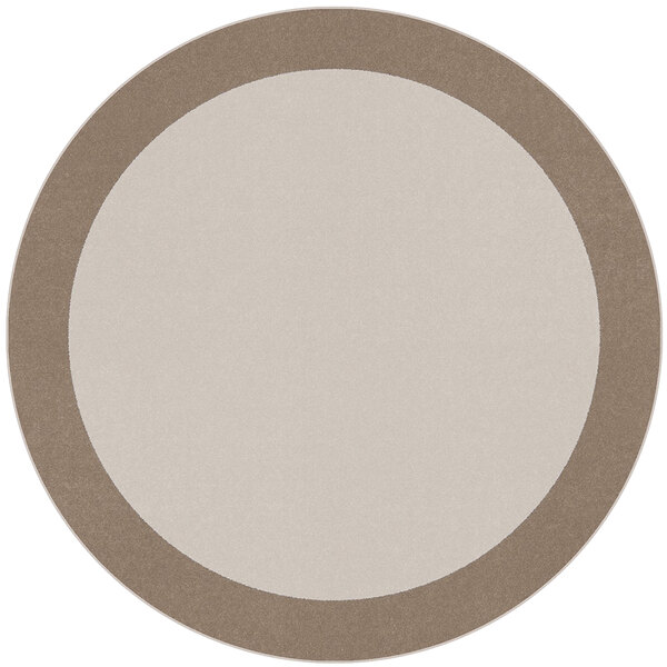 A round white and brown area rug with a beige border.
